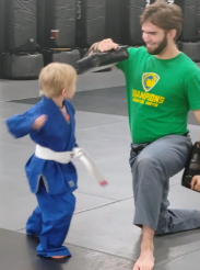 student and teacher practicing karate
